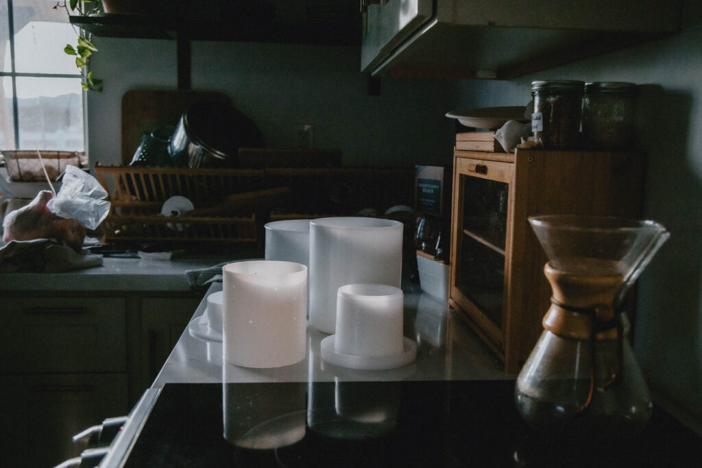 A variety of cheesemaking supplies sits in a homestead kitchen.